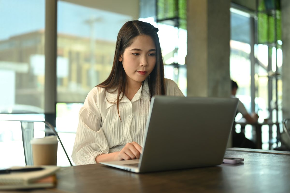 concentrated-businesswoman-working-with-laptop